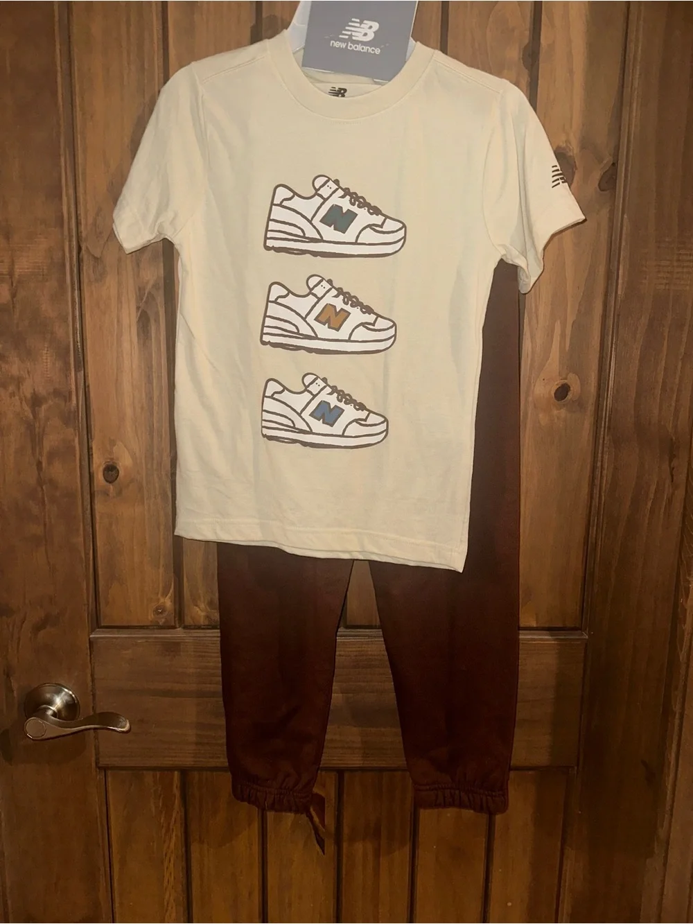 New Balance Cream Tee with Multicolored Sneaker Logos